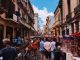 5 Tips To Travel Safely In The Pandemic 6 people standing on road beside market and high rise buildings